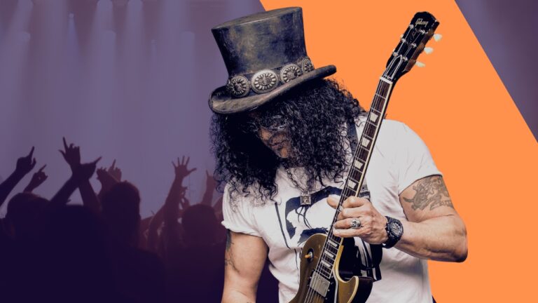 Image Depicts Slash, a Rock Guitarist, Performing on Stage, Wearing a Top Hat and Playing a Les Paul Guitar, with An Audience in The Background Cheering