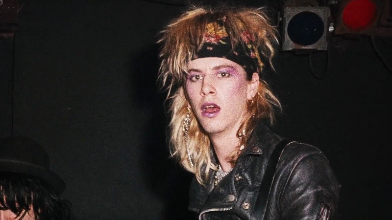 Young Duff McKagan wearing a leather jacket and bandana during his early Guns N’ Roses days