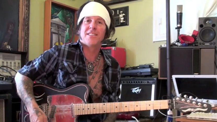 Tracii Guns plays guitar at home