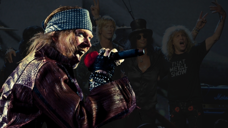 Axl Rose performs on stage while former bandmates pose in the background during the Rock Hall event he refused to attend